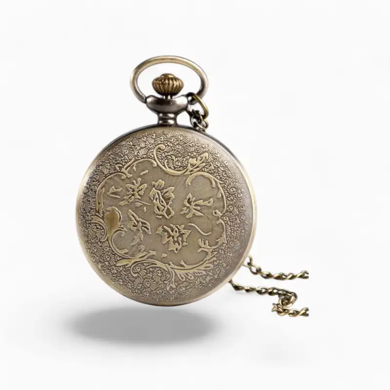 Montre à gousset vintage en métal doré avec des motifs floraux gravés, inspirée du Petit Prince, chaîne incluse.