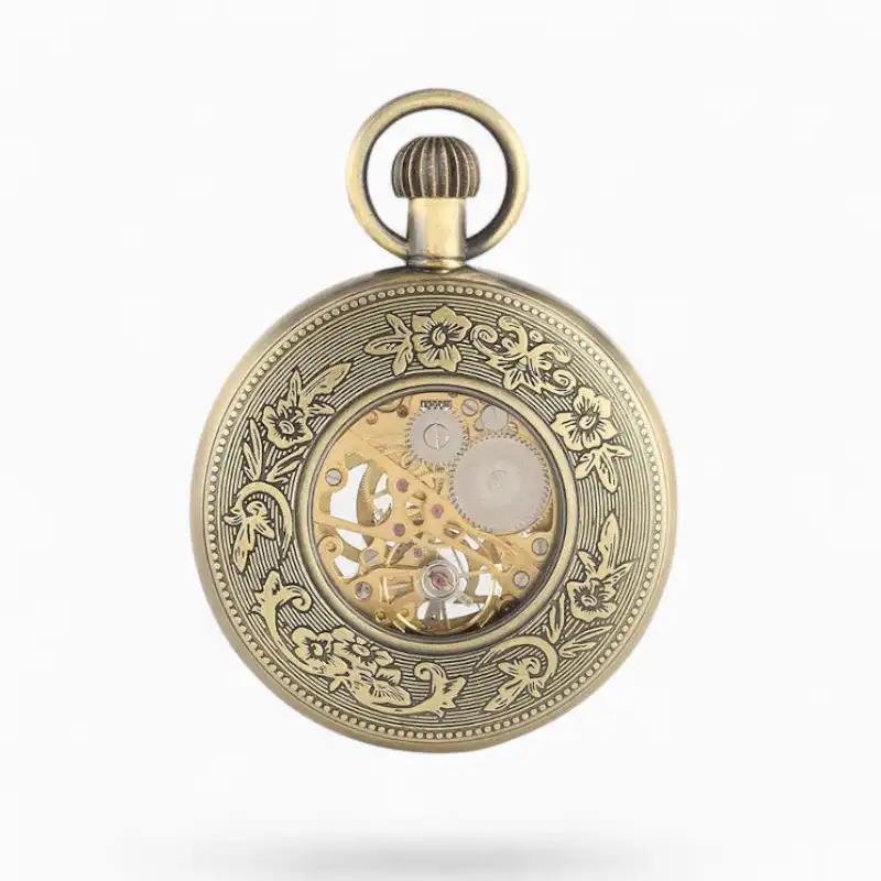 Montre à gousset mécanique Art Déco en or avec motifs floraux gravés et mécanisme apparent.