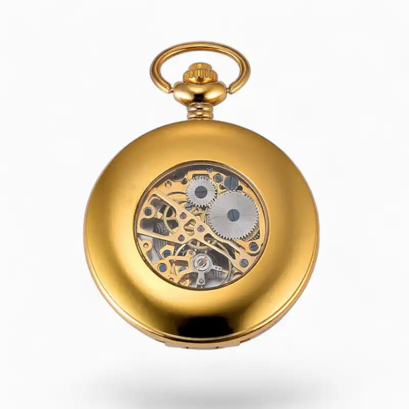 Montre à gousset mécanique Dandy au design raffiné avec mécanisme visible, finitions en or et style vintage élégant.