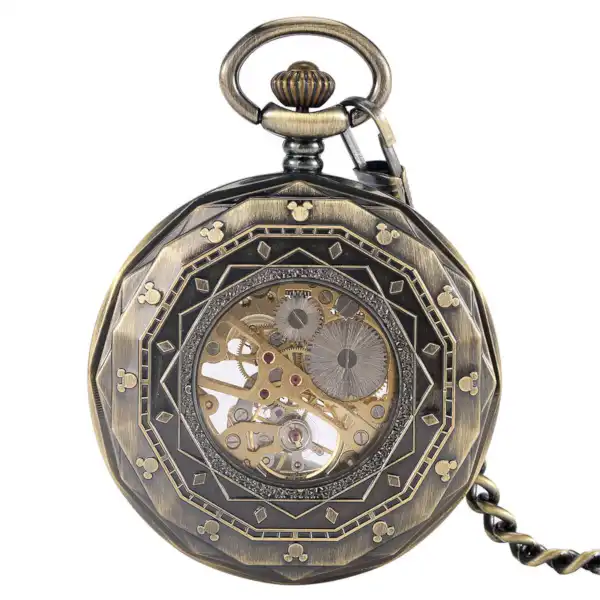 Montre à Gousset Mécanique Vintage avec cadran ouvert révélant le mécanisme, entouré d'ornements noirs et d'éléments dorés.